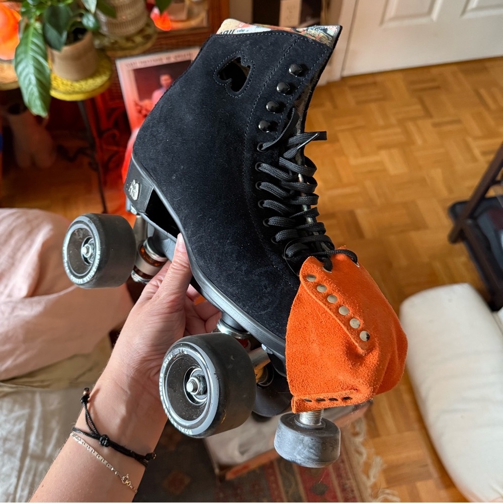 Black Moxi Lolly Roller Skates with Orange Rollerstuff Toe caps